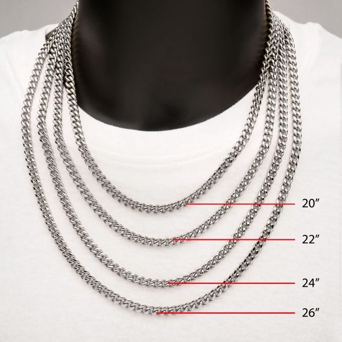 A black mannequin in a white shirt dons four stunning silver chains of varying lengths: 20 inches, 22 inches, 24 inches, and 26 inches. Among them is a striking INOX 6mm Steel Miami Cuban Chain (20"), making this display a perfect example of timeless style and elegance.