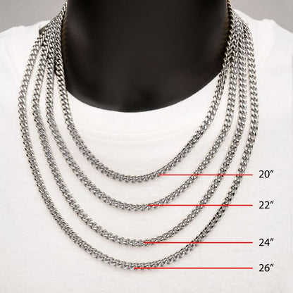 A close-up image of a person wearing a white shirt, showcasing four INOX 8mm Steel Miami Cuban Chains of different lengths around their neck. The men's necklaces are labeled as 20 inches, 22 inches, 24 inches, and 26 inches from top to bottom. The stainless steel chains stand out against the solid black background.