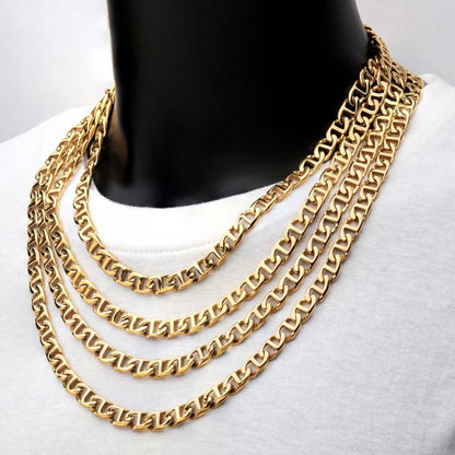 A display mannequin with black neck and shoulders showcases a stunning 8mm 18K Gold Plated Mariner Link Chain from INOX, each featuring a thick, flat Mariner link design and measuring 24 inches in length. This elegant fusion of traditional charm and modern style rests over a plain white garment, offering an aesthetic akin to a men's stainless steel necklace.