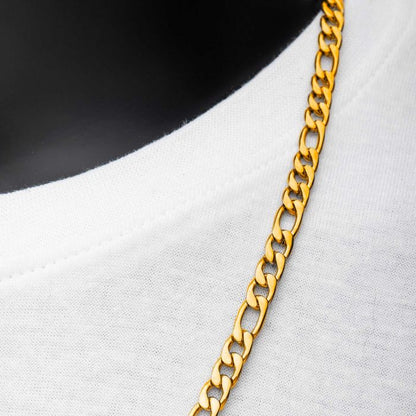 Close-up of an INOX 6mm 18K Gold Plated Figaro Chain | 20" draped over a soft white fabric, seemingly worn around a neck. The men's stainless steel necklace features a pattern of interlocking links, and the smooth fabric contrasts with the metallic shine of the chain.