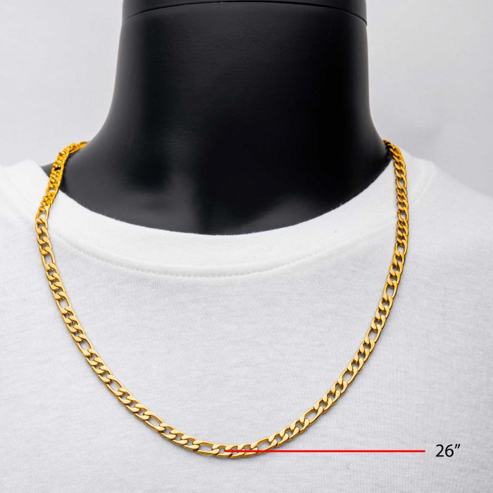 A close-up image showcases the INOX 6mm 18K Gold Plated Figaro Chain on a mannequin dressed in a white shirt. The chain, which exhibits a straightforward interlocking design, measures 20 inches in length as highlighted by red text. The background is plain and gray.