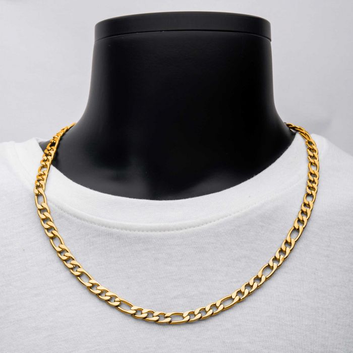 The 8mm 18K Gold Plated Figaro Chain by INOX is elegantly displayed on a black mannequin bust with a white t-shirt. This men's necklace, measuring 22 inches, features an elegant design with interlocking links.