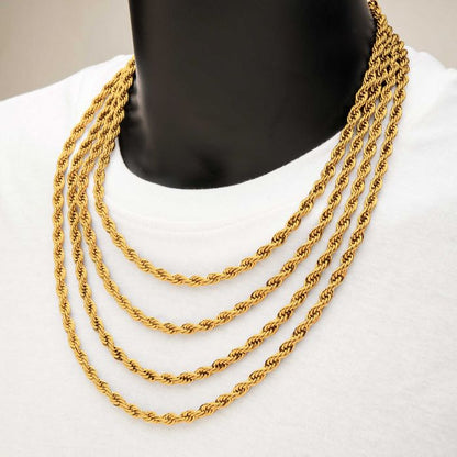 Close-up of a person wearing a white shirt and an 18K gold plated rope chain from INOX around their neck. The background is a neutral tone. The men's necklace, measuring 6mm in width and 20 inches in length, is intricately twisted, creating an elegant and luxurious appearance.