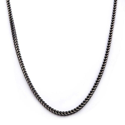 A close-up image of the INOX 8mm Oxidized Steel Franco Chain for men, shown against a plain white background. The 20" oxidized steel chain features a uniform, tightly woven pattern that creates a subtle shine.