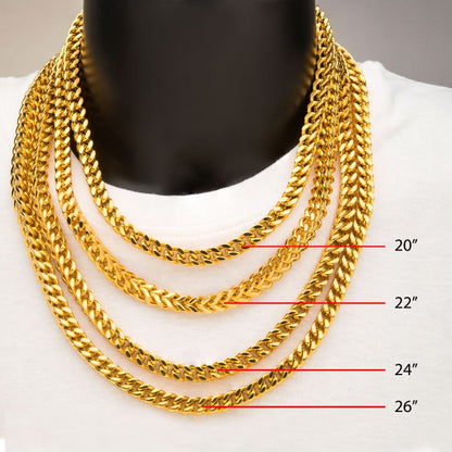 A striking showcase features four 4mm 18K gold plated Franco chains from INOX, elegantly draped around a black mannequin neck adorned with a white shirt. Each men's necklace is meticulously labeled with markers indicating their respective lengths from top to bottom: 20", 22", 24", and 26".