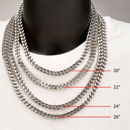 A mannequin wearing a white shirt displays four men's INOX stainless steel Franco chains of varying lengths around its neck. The 6mm steel chains measure 20 inches, 22 inches, 24 inches, and 26 inches in length, with red lines indicating each chain's length.