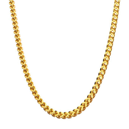 A close-up image showcases the INOX 4mm 18K Gold Plated Franco Chain. This men's necklace features interlocking links that create a continuous, intricate pattern with a twisted, rope-like design. The shiny gold-plated surface accentuates its luxurious appearance against a plain white background.