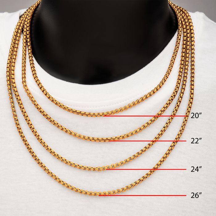 A person is wearing four 4mm 18K Gold Plated Bold Box Chain Necklaces by INOX over a white shirt. The chains are neatly arranged with sizes labeled: 20 inches, 22 inches, 24 inches, and 26 inches from top to bottom respectively.