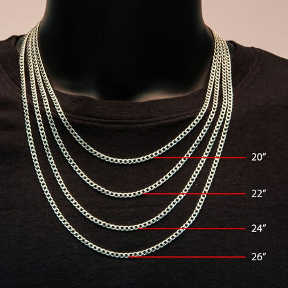 A black mannequin, clad in a black shirt, is adorned with five men's necklaces each made of stainless steel chains of varying lengths. The shortest chain is the 4mm Steel Classic Curb Chain by INOX, measuring 20 inches. This is followed by chains measuring 22 inches, 24 inches, and 26 inches. Each chain's length is visibly marked to the right with red lines and white measurement labels.