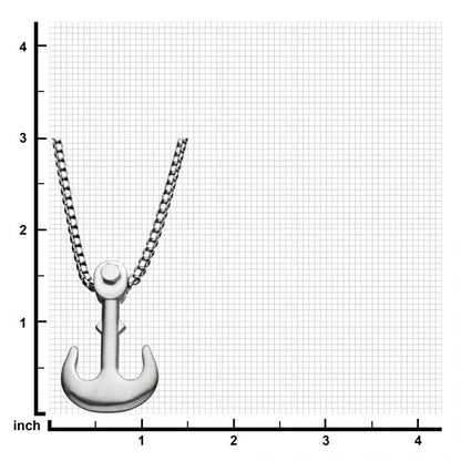 A Matte Steel Man of War Anchor Pendant with Steel Bold Box Chain by INOX, attached to a 24-inch chain necklace, is centered against a gridded background featuring inch measurements along both the vertical and horizontal edges. The pendant is positioned approximately between the 1 to 2-inch marks on the grid.