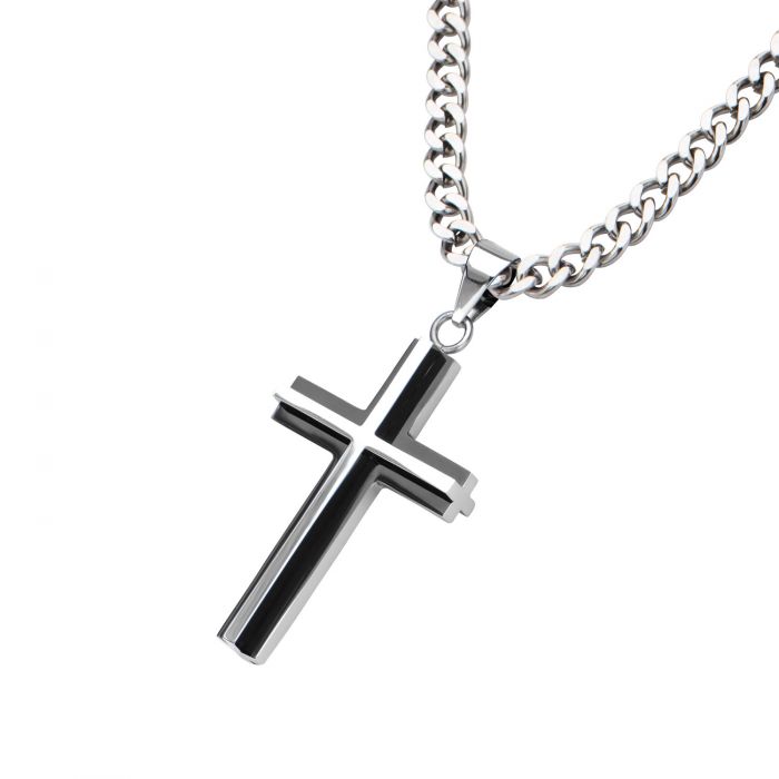 A close-up of the Stainless Steel Black Plated & Steel 3D Cross Pendant with chain by INOX, featuring the men's pendant with a black inlay, hanging on a thick silver necklace. The design is sleek and modern, with polished surfaces reflecting light, accentuating the contrast between the shiny silver and the black inlay on the cross.